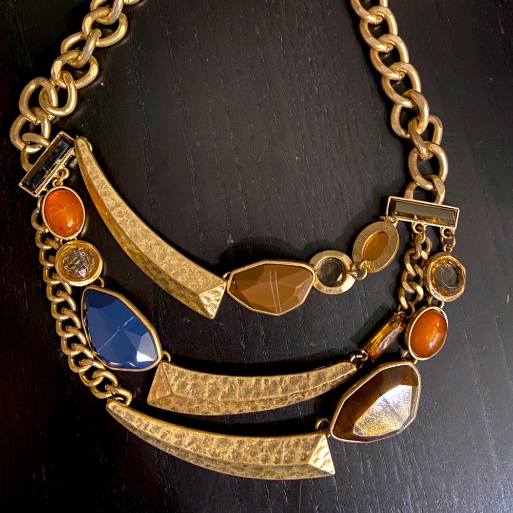 Multi strand custom jewelry with brown , orange beige and navy stones